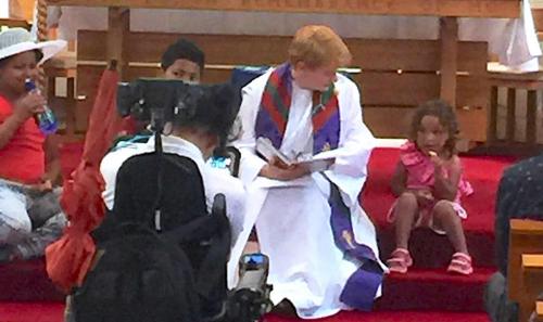 The Rev Jill with the children at "